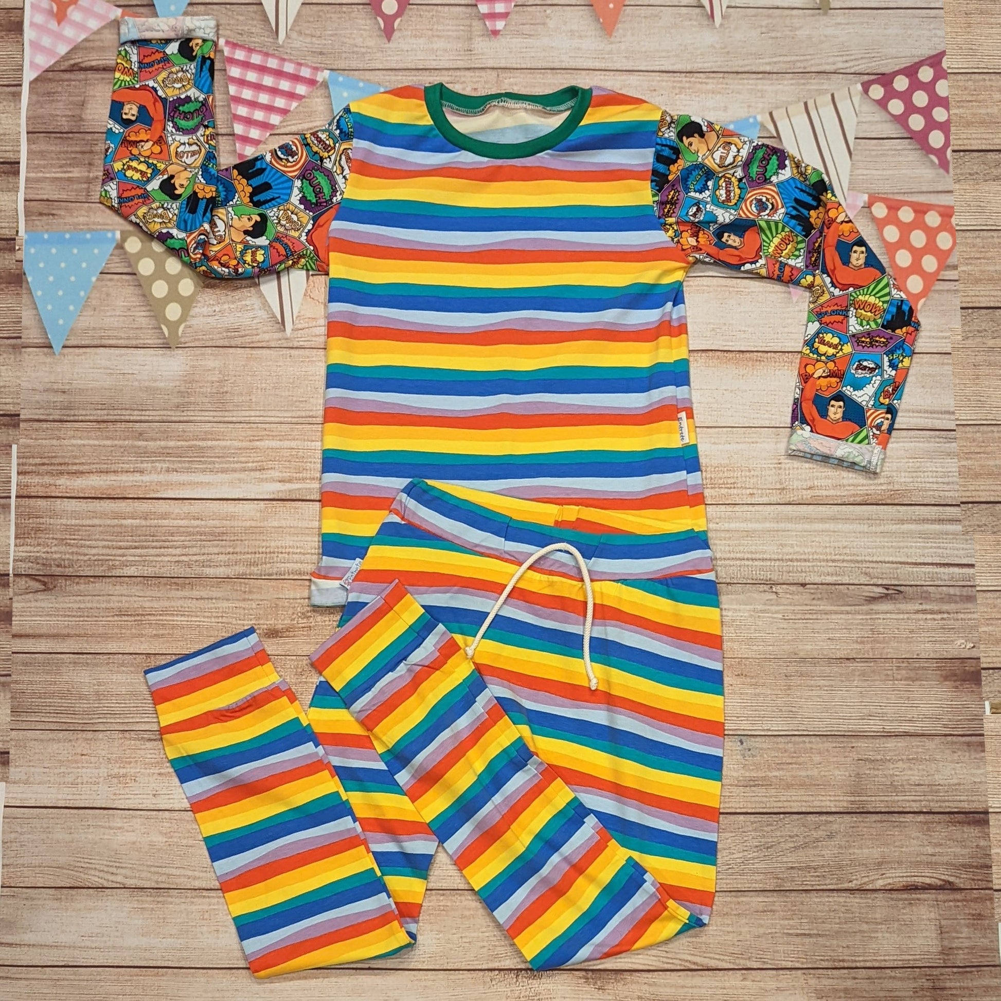 The awesome superhero tee. Handmade using superhero and red rainbow striped cotton jerseys' and green cotton ribbing. Shown with matching red rainbow striped harem joggers.