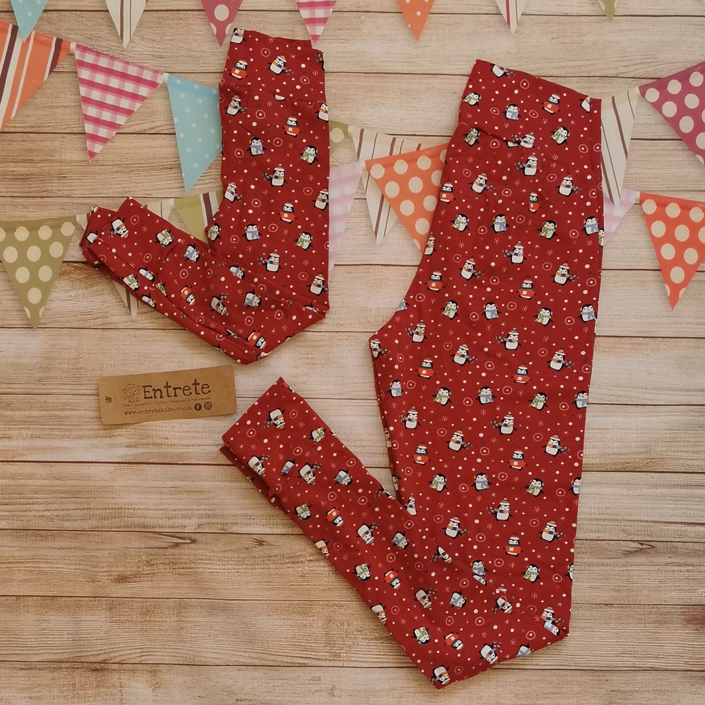 Fantastically festive red penguins Mama's leggings. Shown as a set with a pair of matching kids leggings. (sold separately)