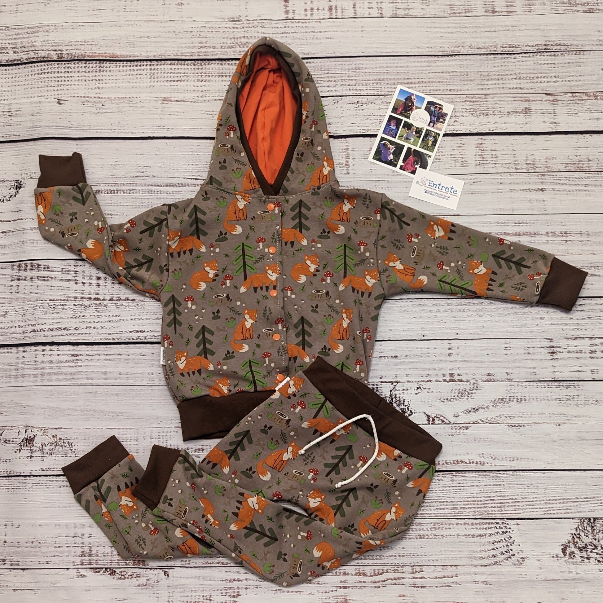 The sumptuously soft forest foxes popper hoodie. Handmade using forest foxes alpine fleece, chocolate cotton ribbing and orange cotton jersey.  Shown as a set with forest foxes harem joggers.