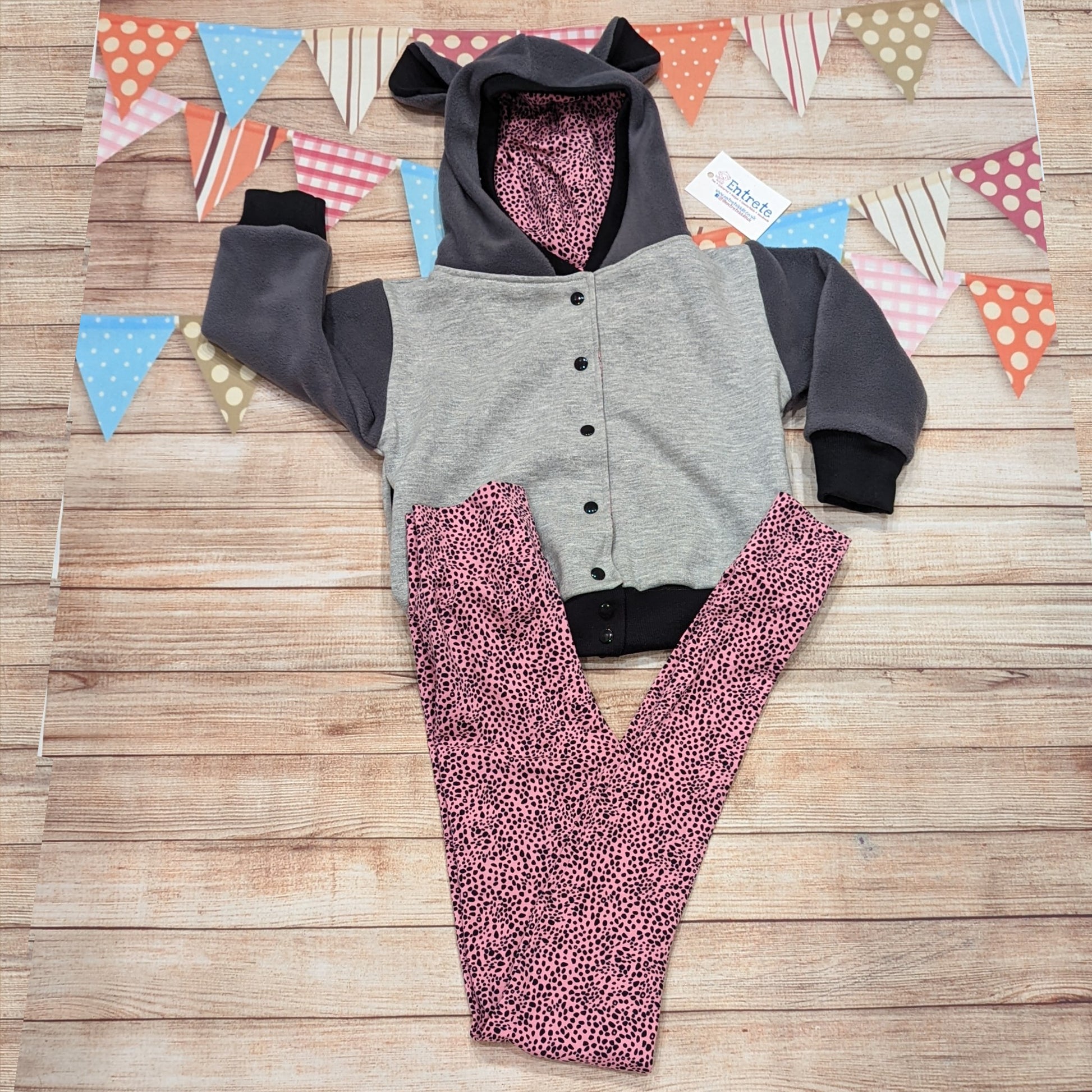 The adorable and fun reversible cat hoodie, shown as an outfit with matching pink cheetah print leggings.