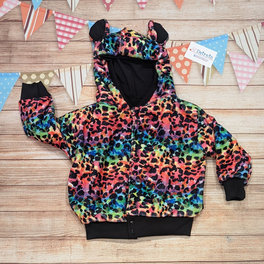 The colourful and warm rainbow leopard hoodie. Handmade using rainbow leopard print bubs fleece, black cotton ribbing, with a black cotton jersey reverse.