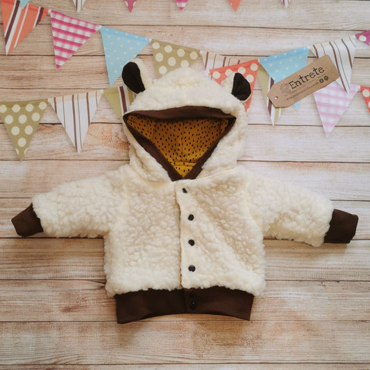 The adorable reversible sheep hoodie with sherpa fur and ears on the hood.