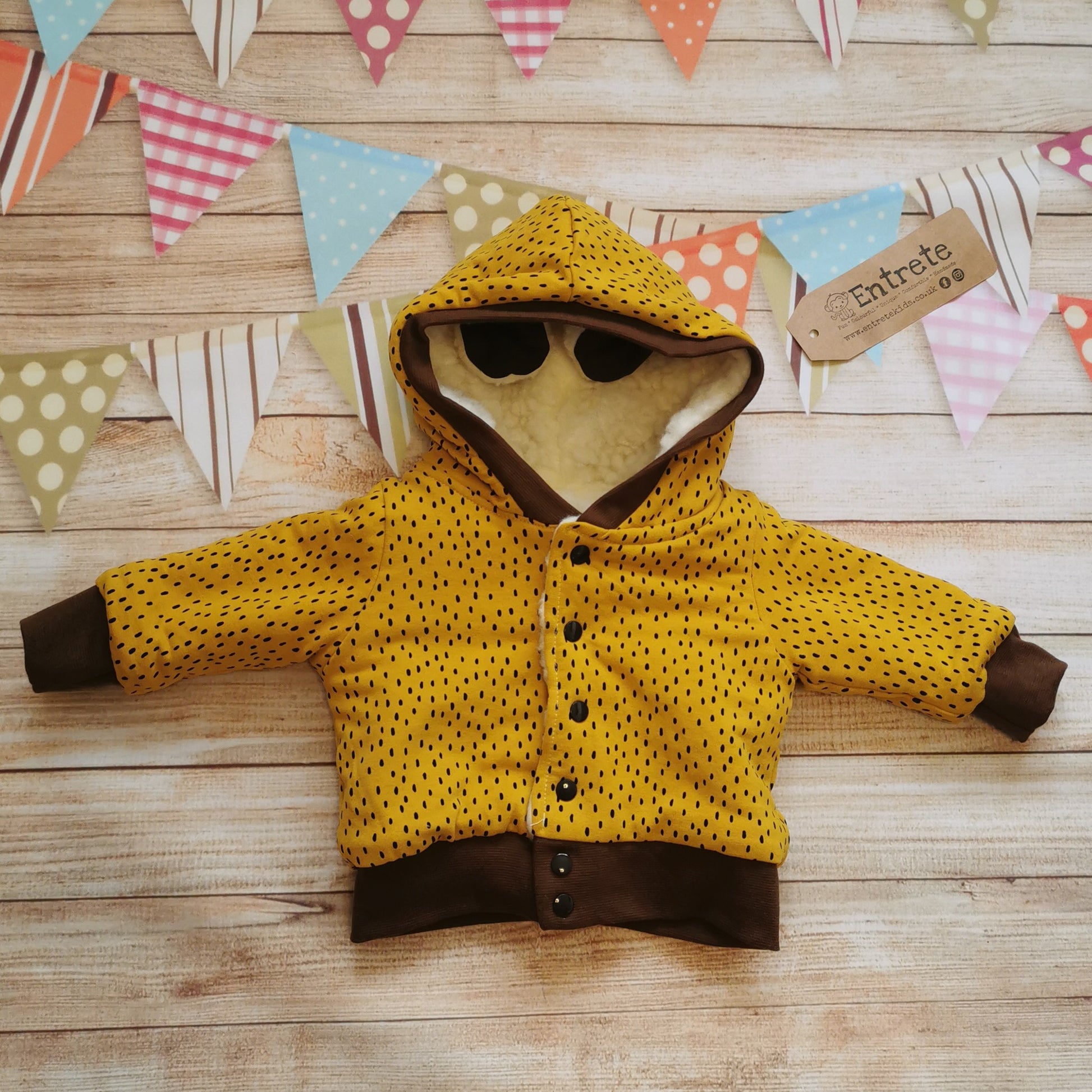 The reverse side of the sheep hoodie. Handmade using stunning ochre dots cotton French terry with chocolate cotton ribbing.