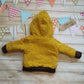Rear of the reverse side of the sheep hoodie. Handmade using stunning ochre dots cotton French terry with chocolate cotton ribbing.