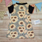The warm sunflower T-shirt dress, handmade using sunflowers cotton French terry, black cotton jersey and black cotton ribbing. Short sleeved version shown from the rear.