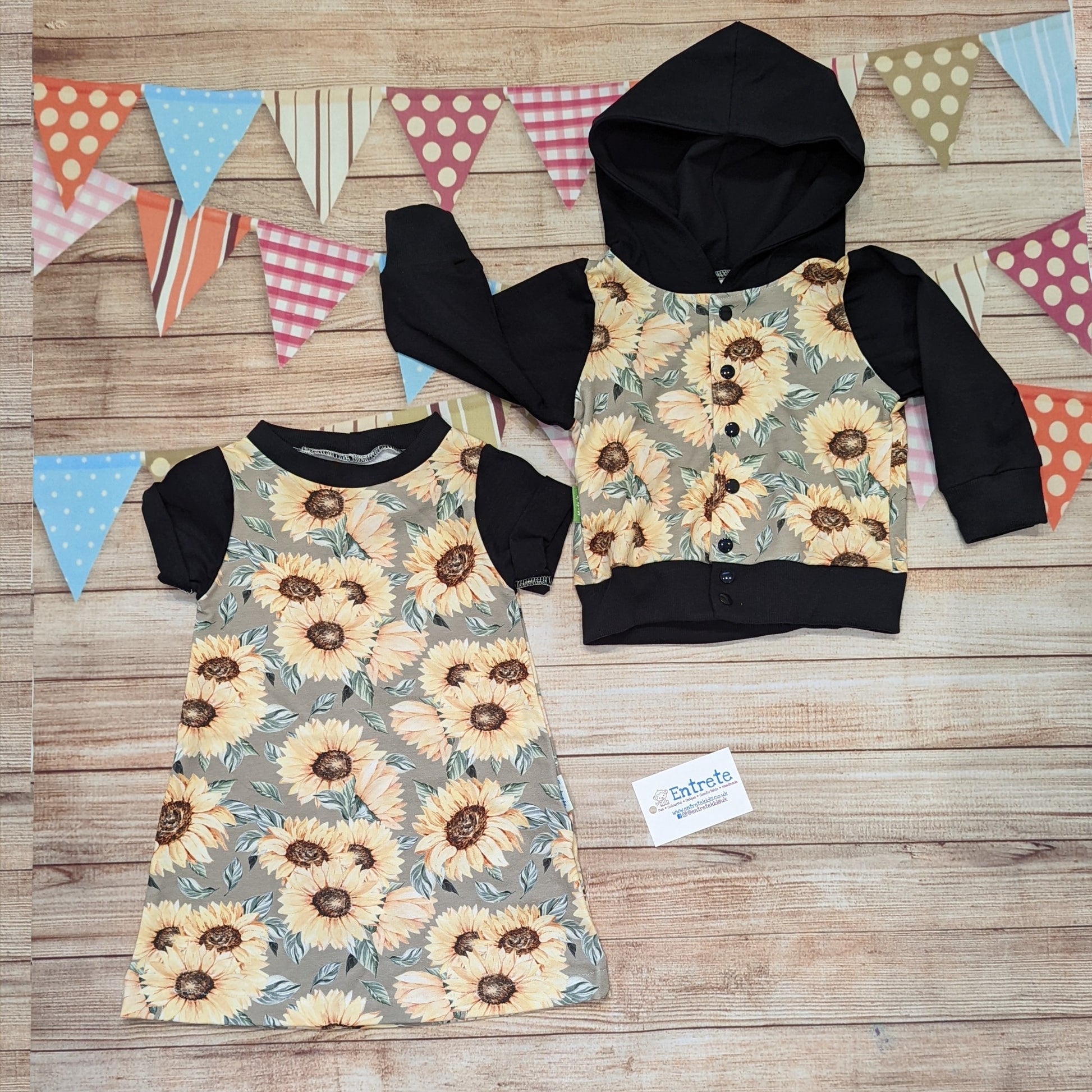 The warm sunflower T-shirt dress, handmade using sunflowers cotton French terry, black cotton jersey and black cotton ribbing. Short sleeved version shown with a matching popper hoodie.