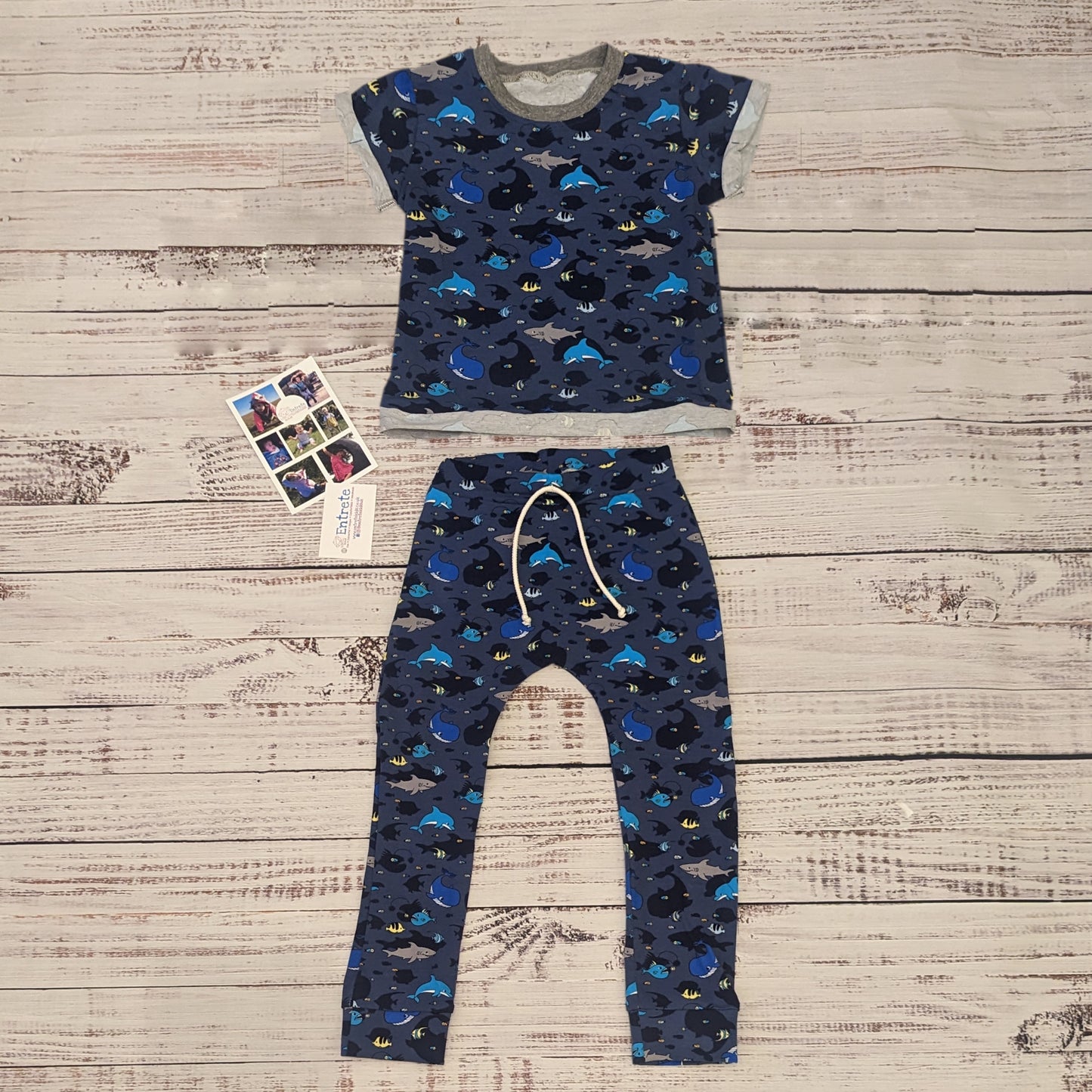 Kids navy sea creatures harem joggers. Handmade using navy sea life shadows cotton jersey. Shown as an outfit with matching short sleeve T-shirt.