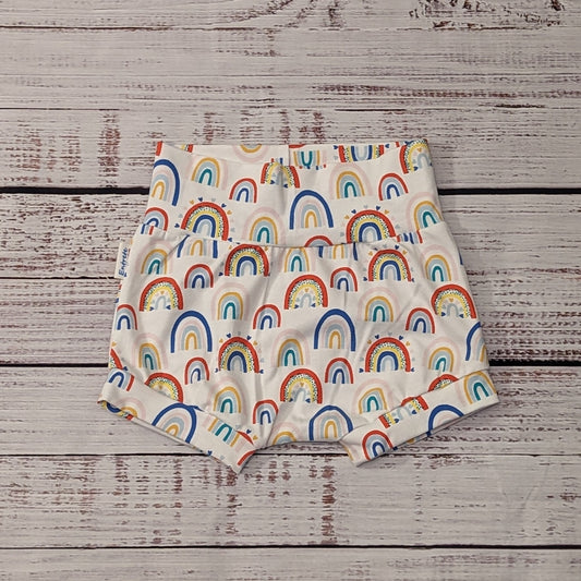The fun colourful rainbows and hearts on white shorts. Handmade using white colourful rainbow hearts cotton jersey.