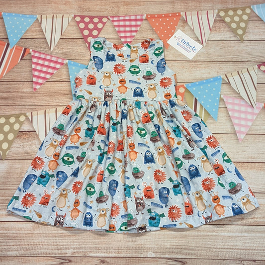 The ethical and fun girls monsters dress. Handmade using organic pale blue monsters cotton jersey.