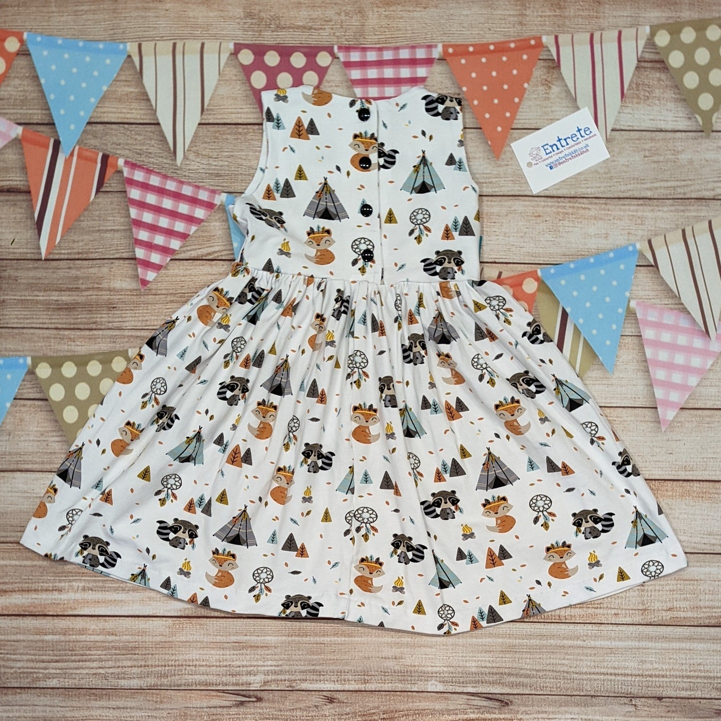 The adorable and fun fox and raccoons girls dress. Handmade using native American animals cotton jersey. Sleeveless version shown, from the rear with poppers to the waist as you get in sizes 9-12 months and above..