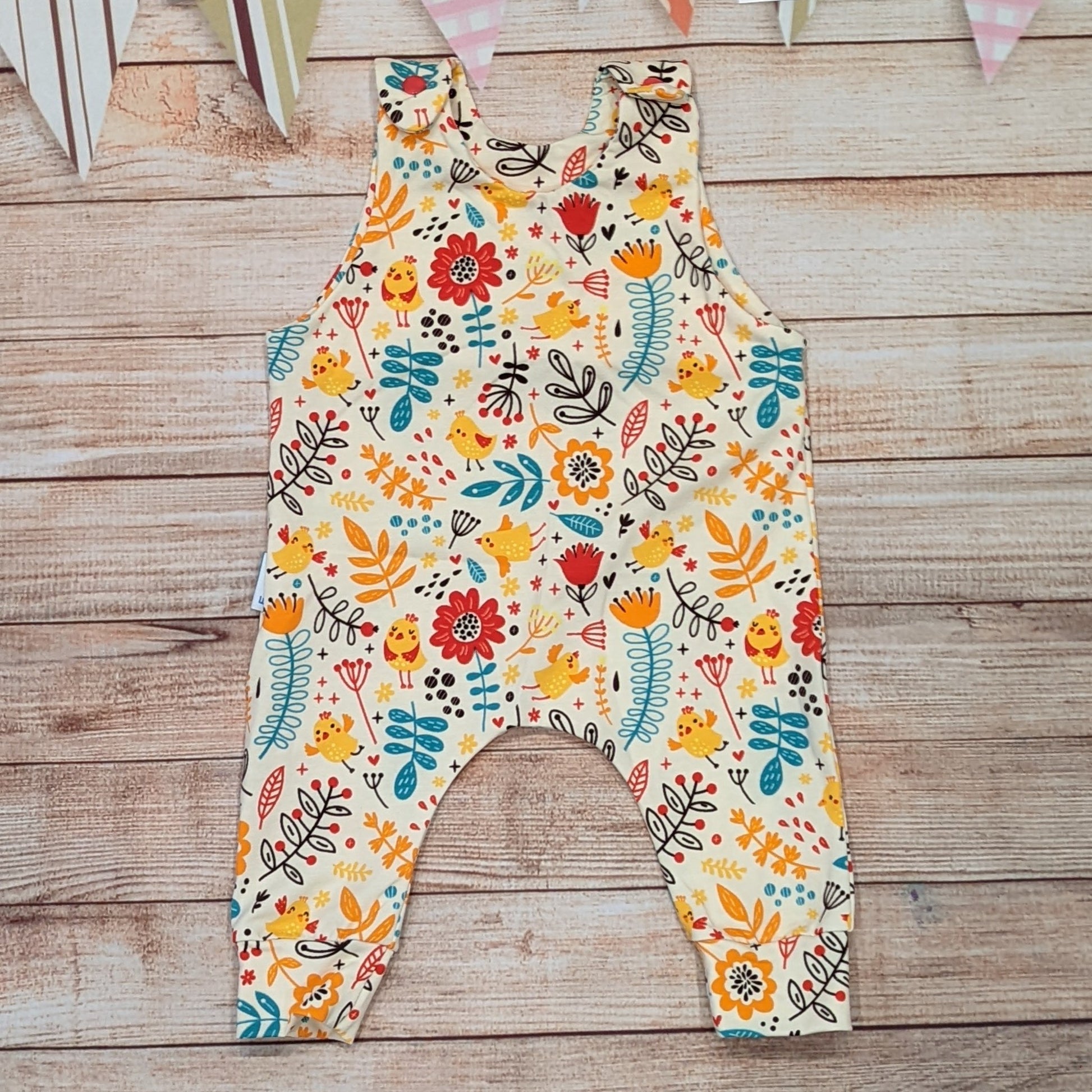 The gorgeous cream chicks and flowers sleeveless romper, perfect for spring. Handmade using cream chicks cotton jersey.