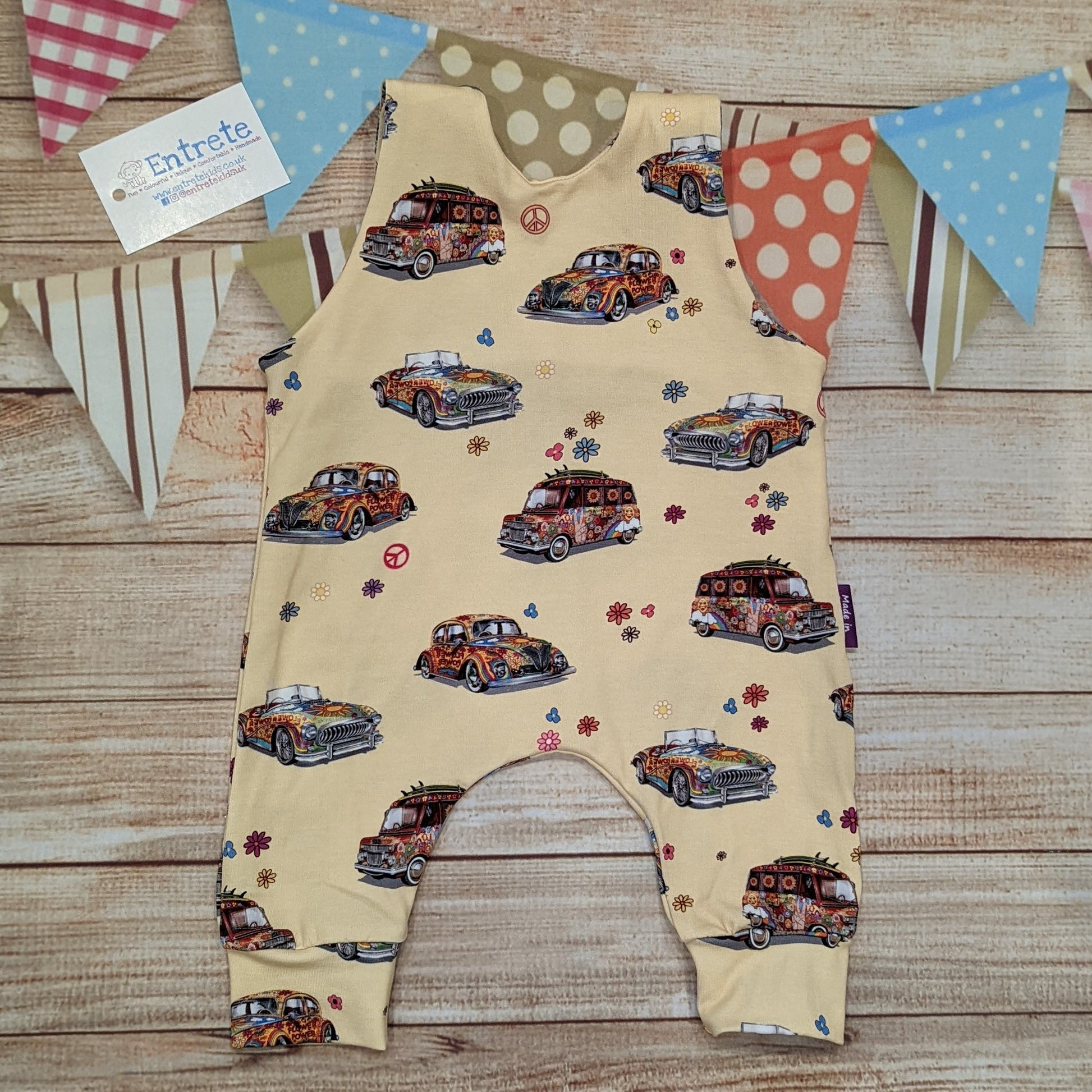 The fun retro hippie cars sleeveless romper, handmade using light yellow hippie cars cotton jersey. Shown from the rear.