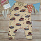 The fun retro hippie cars sleeveless romper, handmade using light yellow hippie cars cotton jersey. Shown from the rear.