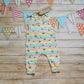 Front of Child & Babies sleeveless romper, handmade using rainbow stars cotton jersey. Featuring shoulder popper entry.