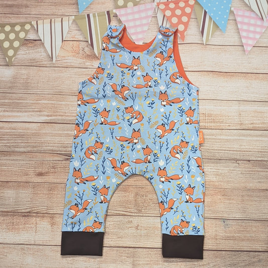 The adorable fantastic sky blue foxes romper. Handmade using sky blue foxes, orange and brown cotton jerseys'.