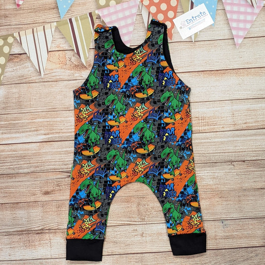 The insanely fun skateboarding dinosaurs romper. Handmade using street dino cotton French terry and black cotton jersey.
