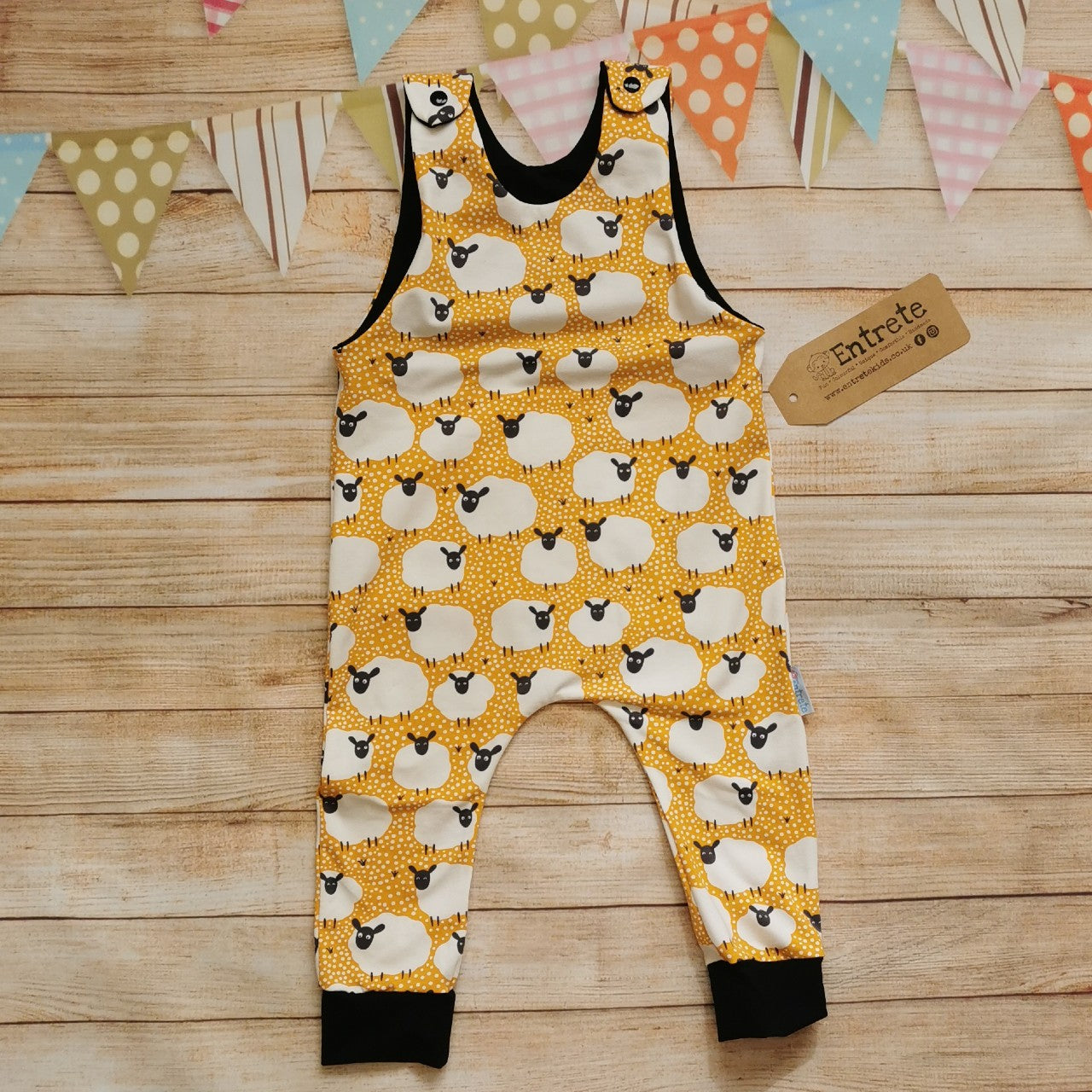 The fun mustard sheep romper, perfect for your little lamb. Handmade using mustard sheep and black cotton jerseys'.