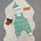 A romper gift set shown in mint penguins for demonstration purposes, your gift set will be handmade in cream chicks cotton jersey.
