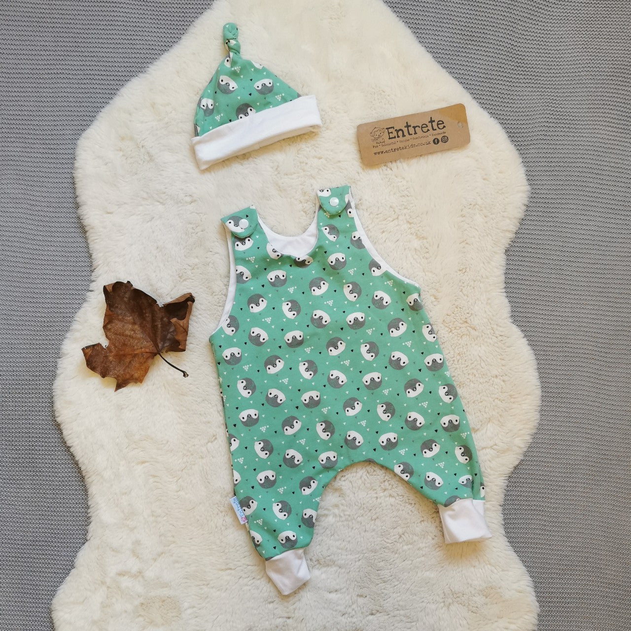 A romper gift set handmade using mint penguins organic cotton jersey.