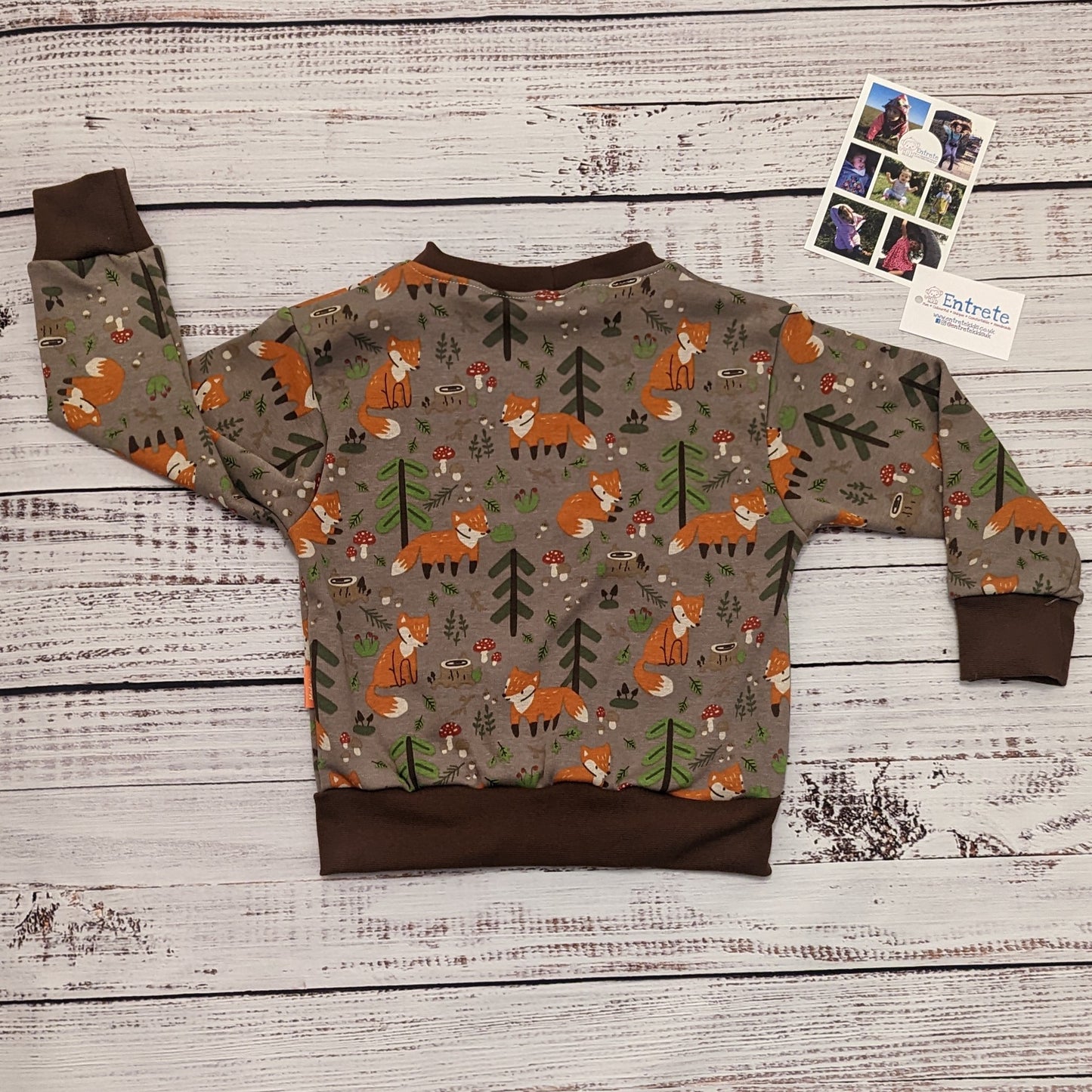 The warm, sumptuously soft and fun forest foxes sweatshirt. Handmade using brown forest foxes alpine fleece and brown cotton ribbing. Shown from the rear.