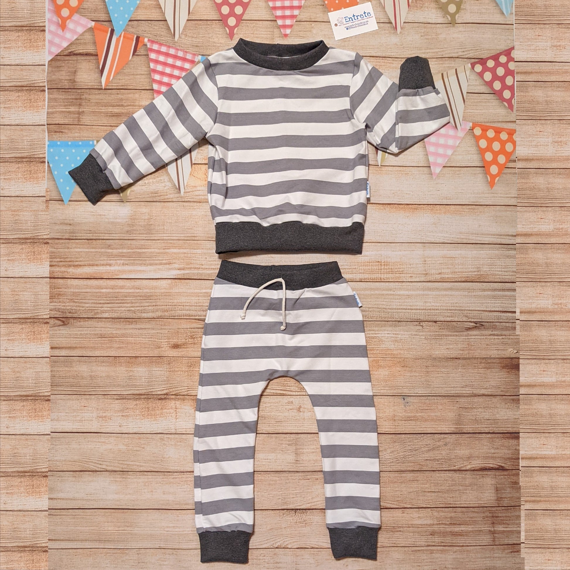 Grey and white striped harem joggers. Handmade with grey striped cotton French terry and graphite cotton ribbing. Shown as an outfit with a matching grey striped sweatshirt (sold separately).