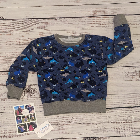 The amazing sea life sweatshirt, packed full of your favourite sea creatures. Handmade using navy sea life shadows cotton jersey and grey cotton ribbing.
