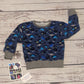 The amazing sea life sweatshirt, packed full of your favourite sea creatures. Handmade using navy sea life shadows cotton jersey and grey cotton ribbing.