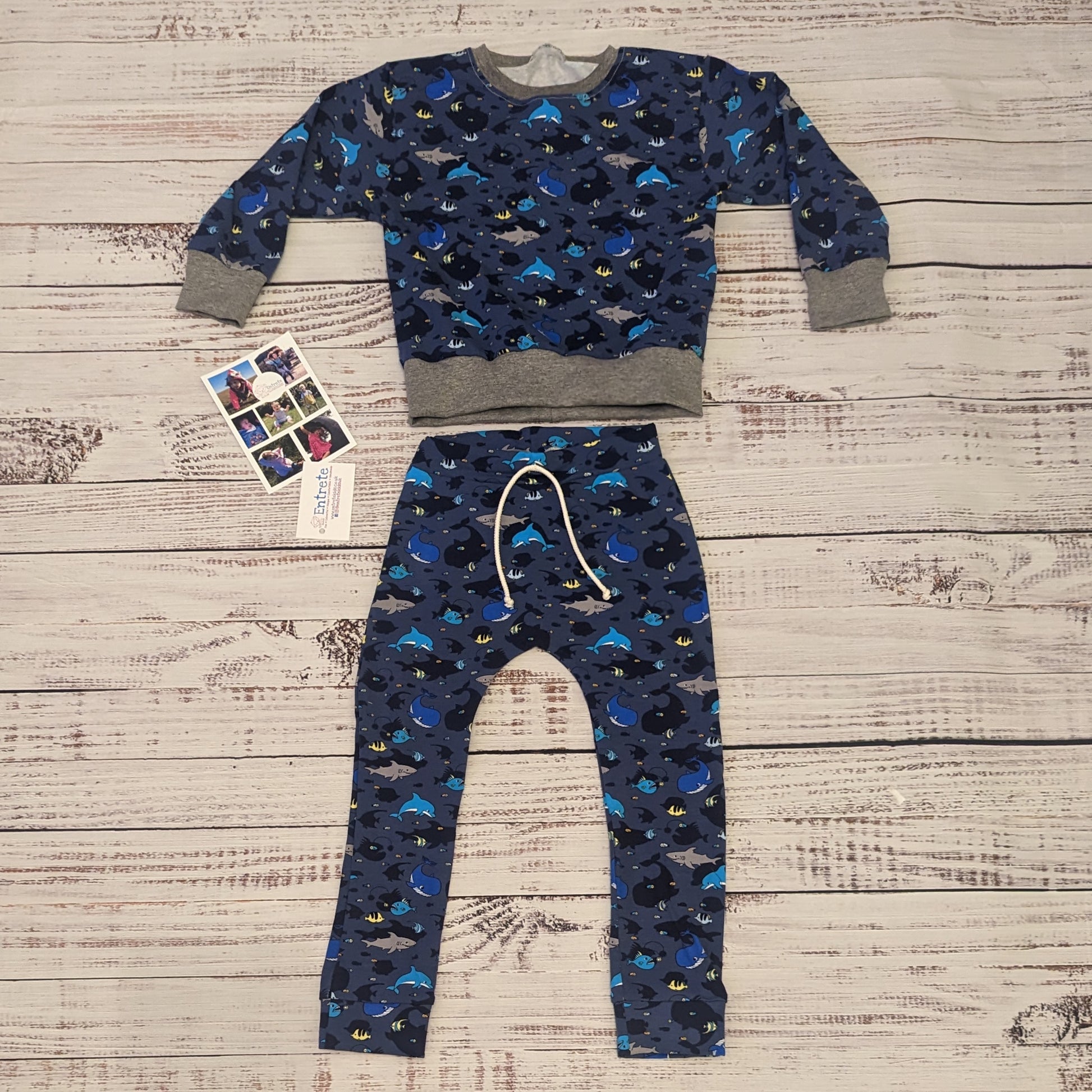 The amazing sea life sweatshirt, packed full of your favourite sea creatures. Handmade using navy sea life shadows cotton jersey and grey cotton ribbing. Shown as an outfit with matching harem joggers.