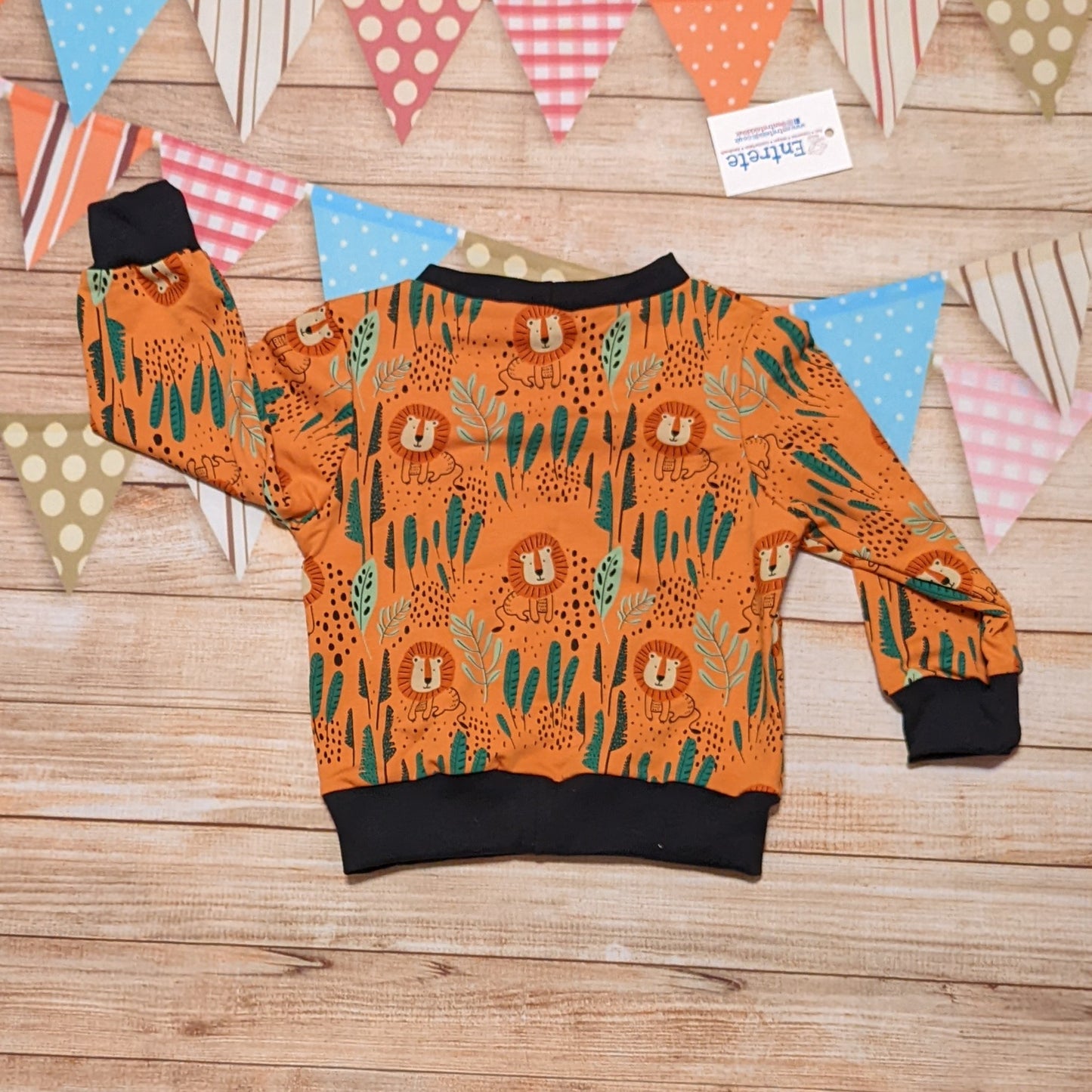 Rear of The ferocious lions sweatshirt, handmade using orange lions cotton French terry and black cotton ribbing.