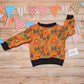 The ferocious lions sweatshirt, handmade using orange lions cotton French terry and black cotton ribbing.