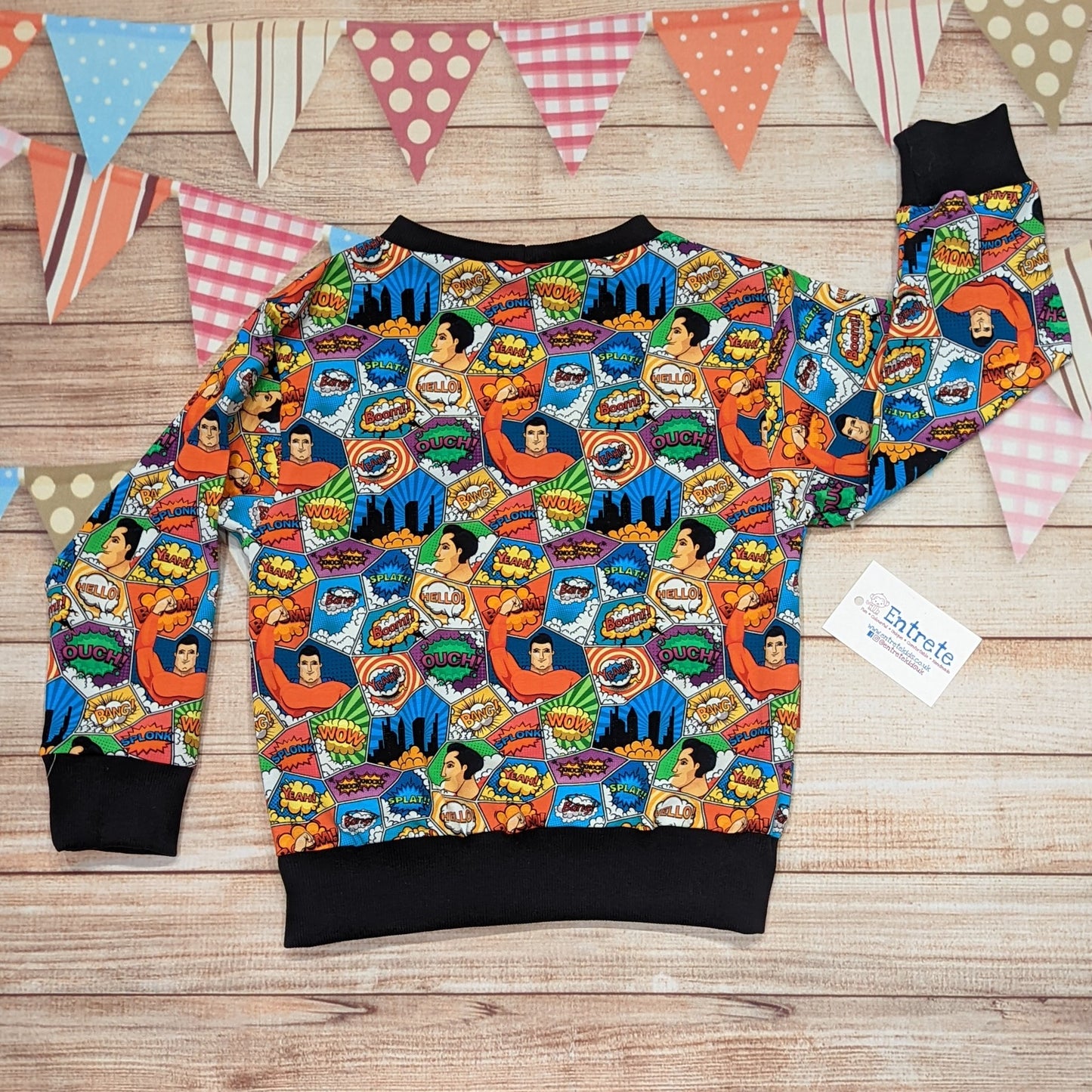 The awesome superhero sweatshirt. Handmade using colourful superhero cotton jersey and black cotton ribbing. Shown from the rear.