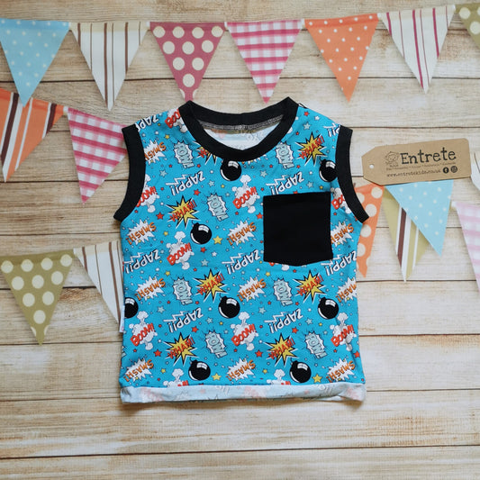 Child & Toddlers vibrant tank top, handmade using turquoise cartoon bombs cotton jersey, with graphite cotton ribbing, a black front pocket and rolled waist.