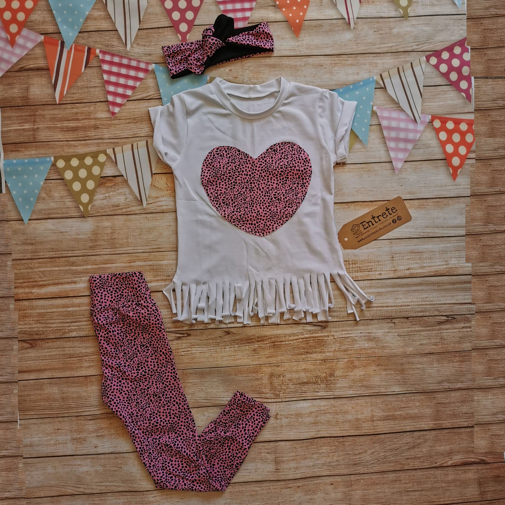 Kids pink cheetah leggings, shown as an outfit with a gorgeous pink cheetah heart tassel tee and matching headband. (sold separately).