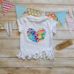 Gorgeous watercolour rainbow hearts heart tassel t-shirt. Lovingly handmade with rolled cuffs and tassels at the waist.