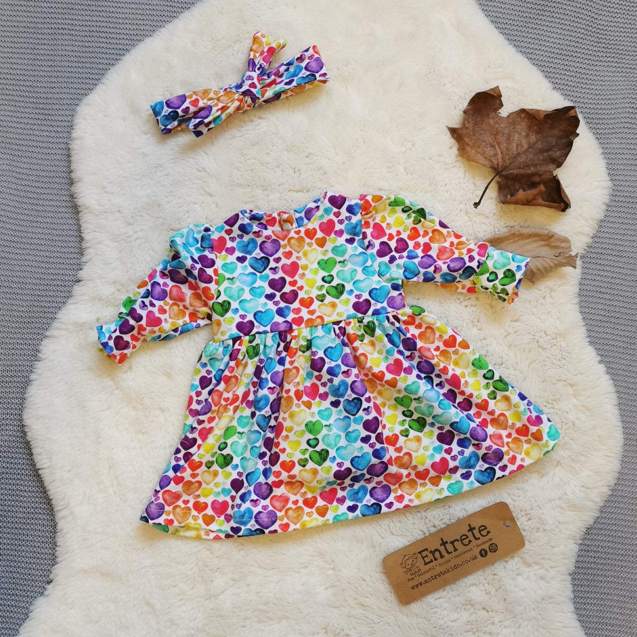 A dress gift set shown in rainbow hearts for demonstration purposes, your gift set will be handmade using feathers cotton jersey.