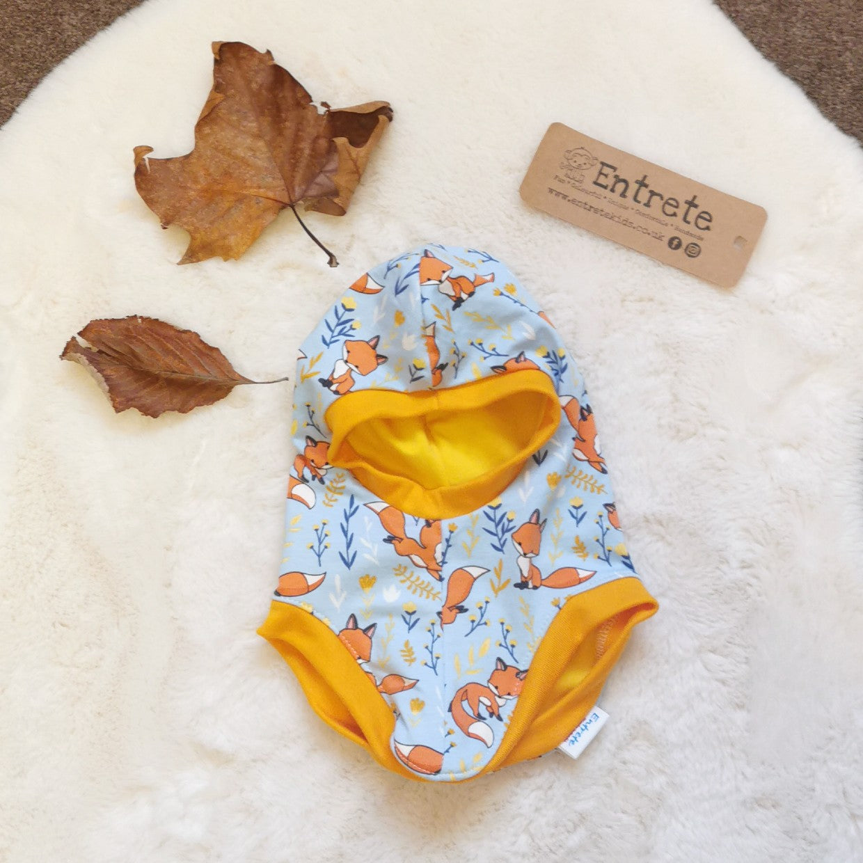 Soft and stretchy kids balaclava handmade using sky blue foxes cotton jersey, yellow ribbing and yellow cotton jersey lining.