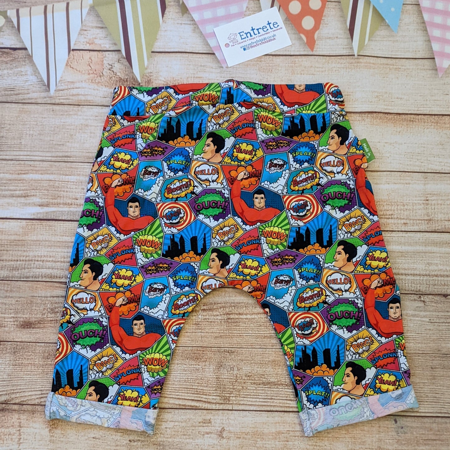 The awesomely colourful superhero harem shorts, perfect for the little superhero in your life. Handmade using superhero cotton jersey. Shown from the rear.