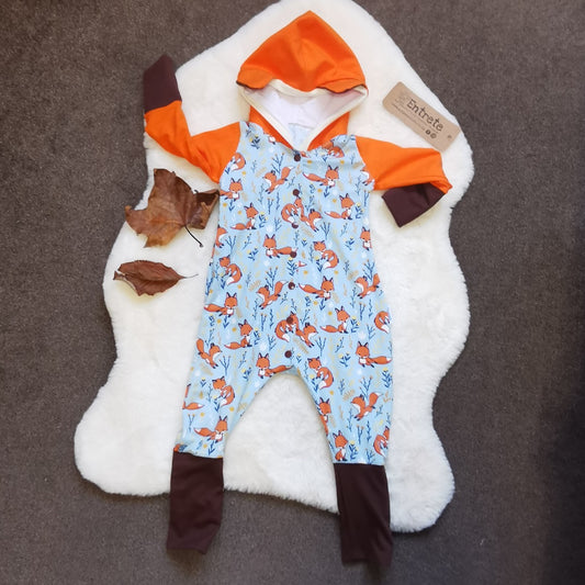 The adorable hooded fox romper, great for role play. Handmade using sky blue foxes, orange, brown and white cotton jersey's and cream cotton ribbing.