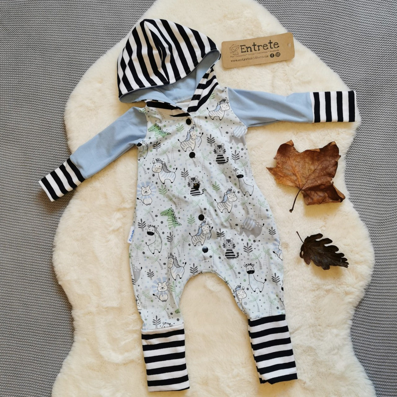 The adorable kids animals romper with contrasting monochrome stripes. Handmade using light blue kids animals, baby blue and monochrome striped cotton jerseys'.