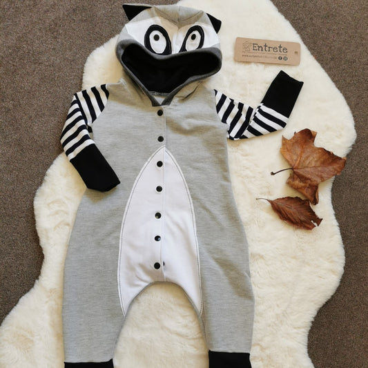 The super fun Raccoon romper has lots of intricate detailing, your little one will love being a Raccoon! Handmade using grey cotton sweat fabric, monochrome striped, white and black cotton jerseys' and graphite cotton ribbing.