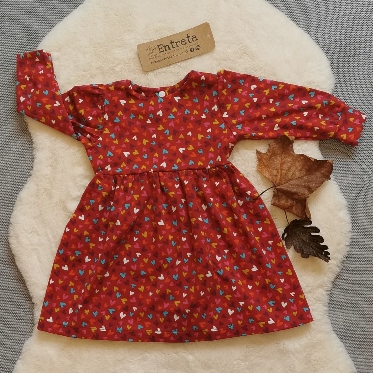 Front view of the autumnal red min hearts dress. Lovingly handmade from soft and comfortable red mini hearts cotton jersey