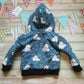 Rear of the reverse side of the adorable polar bear hoodie. Handmade using dusty blue polar bears cotton jersey and black cotton ribbing, with warm sherpa fur lining.
