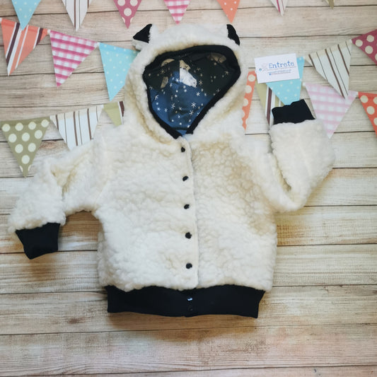 Adorable polar bear hoodie. Handmade using warm sherpa fur and black cotton ribbing, with festive dusty blue polar bears cotton jersey on the reverse.