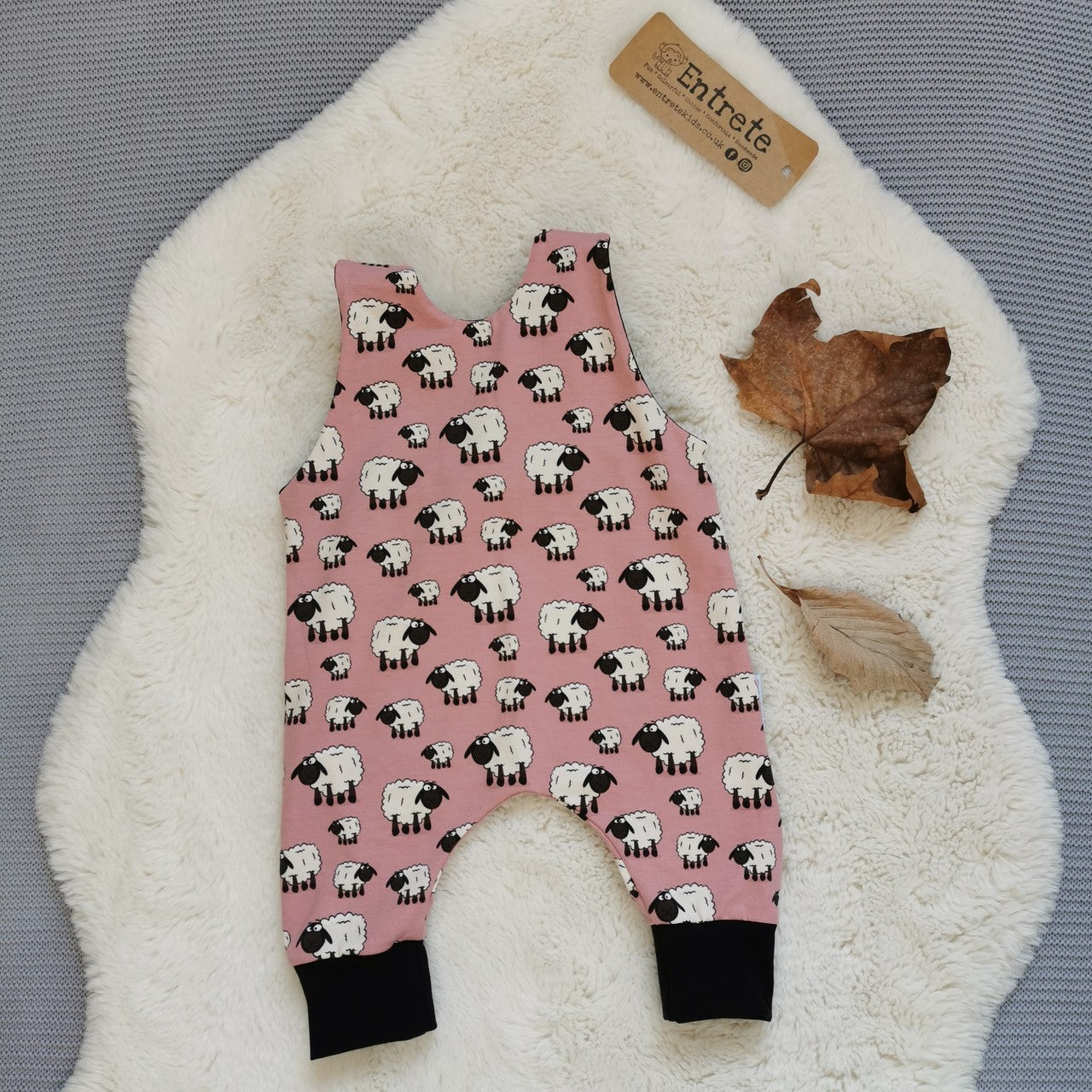 Rear of the adorably fun pink sheep romper. Handmade using pink sheep and black cotton jerseys'.