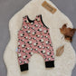 The adorably fun pink sheep romper. Handmade using pink sheep and black cotton jerseys'.