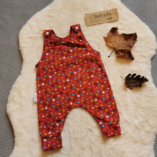 The autumnal red mini hearts romper. Handmade using red mini hearts cotton jersey.